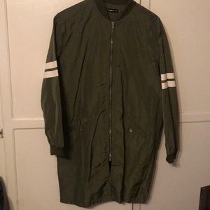 Long green wind breaker.